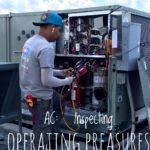 Infinite technician inspecting operating pressure