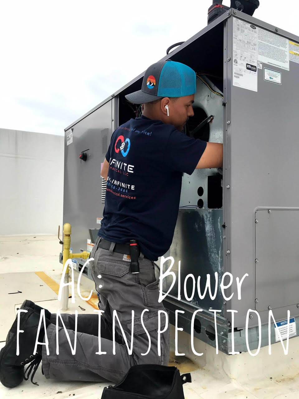 technician working on HVAC blower fan inspection